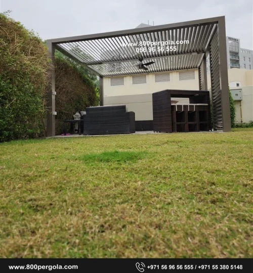 Fixed Louvered Pergola with aluminum elliptical louvers and a privacy screen at Safi Townhouse, Dubai
